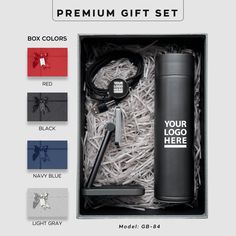 the gift set includes a bottle, pen and headphones in a box with its contents