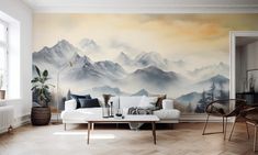 a living room filled with furniture and a painting on the wall