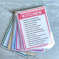 a pile of kitchen cleaning supplies sitting on top of a table next to each other