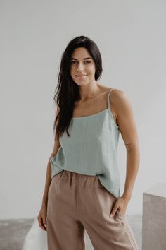 "Elegant, classy linen top. Sleeveless and with a round neckline. Perfect for every occasion - you can wear it to work, the beach or even a night out! Details This listing is for 1 HILO top Agne's height is 177 cm/5'8\" and she is wearing sage green Hilo top in size L for a more oversized look Available in XS, S, M, L, XL. We recommend buying one size up as this model sizes on the smaller side Made from 100% certified European linen Stone washed for maximum softness Available in 11 colors Please Solid Linen Summer Tank Top, Solid Linen Sleeveless Tank Top, Sleeveless Linen Tank Top, Solid Color Linen Sleeveless Tank Top, Linen Sleeveless Tank Top For Vacation, Sleeveless Linen Tank Top For Vacation, Casual Sleeveless Flax Tank Top, Spring Linen Tops In Solid Colors, Linen Tops For Spring