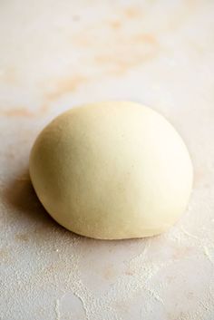 an uncooked doughnut sitting on top of a counter