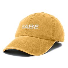 Embrace casual chic with our 'Babe' baseball cap designed for those who appreciate comfort and style. This 6-panel, low crown dad cap is crafted from 100% cotton, ensuring a soft and breathable feel that's perfect for any outing, whether you're spending quality time with family, enjoying a day in the sun, or simply adding a fun twist to your everyday ensemble. Versatility meets functionality with our cap, making it a go-to choice for every occasion. Measuring 11 inches in length, our hat provides ample coverage while maintaining a lightweight and comfortable fit. The fabric strap closure with a metal buckle allows for easy adjustment, ensuring a snug and personalized fit for all head sizes. Its unstructured crown adapts effortlessly to different hairstyles, offering practicality and comfor Comfortable Cotton Snapback Dad Hat, Comfortable Cotton Dad Hat Snapback, Trendy Adjustable Fit Cotton Snapback Hat, Trendy Cotton Adjustable Snapback Hat, Comfortable Cotton Dad Hat, Trendy Adjustable Soft-washed Hat, Trendy Adjustable Cotton Dad Hat, Comfortable Cotton Snapback Baseball Cap, Basic Cotton Baseball Cap With Curved Brim