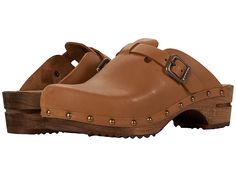 Sanita Kristel - Women's Clog Shoes : Cognac : A sleek oiled leather upper with stylish stud details, the Sanita Kristel slip-on clog keeps you cozy and on-trend. Adjustable buckle at instep with leather and synthetic linings with a leather-lined heel pad. Lime tree wood midsole and outsole. Imported. Measurements: Heel Height: 1 3 4 in Weight: 14 oz Product measurements were taken using size 39 (US Women's 8-8.5), width Regular. Please note that measurements may vary by size. Weight of footwear Leather Clogs With Buckle Closure For Fall, Leather Slip-on Clogs With Buckle Closure, Casual Brown Clogs With Studded Rubber Outsoles, Leather Clogs With Rubber Sole For Fall, Brown Closed Toe Clogs With Studded Outsoles, Brown Clogs With Buckle Closure For Fall, Rugged Leather Clogs With Removable Insole, Brown Fall Clogs With Buckle Closure, Brown Buckle Closure Clogs For Fall