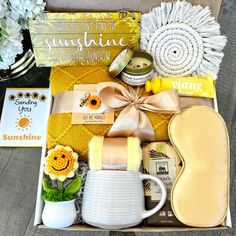 the sun shines gift box is filled with items for someone's special occasion