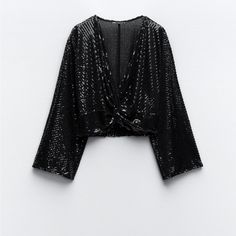 Zara Sequin Crop Top 69.90 Usd Top With Knotted V-Neckline And Long Sleeves. Sequin Appliqus. Black Outer Shell 93% Polyester 7% Elastane Make An Offer! Make It Yours! New! No Flaws. Great Condition. Never Worn/Used Bundle & Save 90% Of The Listed Items Are Never Worn/Used & With Tag Cute Adorable Cool Amazing Awesome High End Surprise Graduation Gift Valentine Bridesmaid Easter Mother's Day Valentine Christmas Wedding Birthday Baby Shower Best Friend Aunt Grandma Girl Spring Summer Fall Winter Glamorous V-neck Top For Night Out, Stretch V-neck Blouse For Party, Glamorous V-neck Winter Top, Glamorous V-neck Tops For Date Night, V-neck Sequin Blouse For Night Out, Fall Party Blouse With Surplice Neckline, Sequined V-neck Tops For Fall, Winter Evening Cropped Tops, Fall Night Out Tops With Surplice Neckline