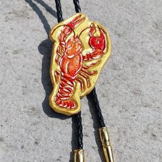 a close up of a cord with a lobster on it