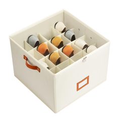 a white box filled with lots of different types of yarn