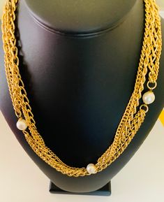 This pretty shiny three layer gold chain necklace is super long and can be worn doubled for a short necklace. It has white creamy pearl accents. The necklace is 48 inches long. This is light weight even though it looks chunky. I specialize in finding fun wearable jewelry please browse my shop for more options. I box all jewelry sales ready to be given as gifts. Gold Multi-strand Pearl Necklace With Adjustable Chain, Gold Pearl Necklace For Layering, Gold Multi-strand Pearl Necklace, Multi-strand Pearl Chain Necklace, Gold Multi-strand Pearl Layered Necklace, Gold Multi-strand Pearl Chain Necklace, Gold Pearl Multi-strand Layered Necklace, Gold Pearl Double Chain Necklace, Multi-strand Pearl Charm Necklace