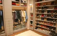 the closet is full of shoes and clothes