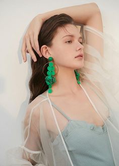 Be bold and make a statement with our Green Hoop Disc Drop Earrings! These striking earrings feature a big hoop design with a disc drop, adding a unique touch to any outfit. Perfect for confident women who want to add a daring touch to their style. 5 6/8" (14.5cm) drop 2 3/8" (6cm) width Post back Alloy, plastic Women's drop earrings Item #452802