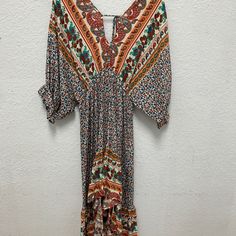 Umgee New With Tags Boho Dress Low Cut Front And Back 3/4 Length Sleeves Multicolor Print V-neck Midi Dress For Vacation, Bohemian V-neck Midi Dress With Vibrant Print, Boho Print Rayon V-neck Dress, Orange V-neck Summer Maxi Dress, Orange V-neck Maxi Dress For Vacation, Orange V-neck Maxi Dress For Beach, Patterned V-neck Boho Dress For Vacation, Multicolor Boho Print Dress For Beach Cover-up, Orange Printed Short Sleeve Maxi Dress