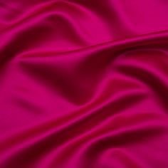 Find your way through the haze with this Magenta Haze Premium Polyester Satin. Featuring a medium weight, sleek hand, and fluid drape, it’s the perfect choice for eye-catching evening wear.Suggested Projects:  Dresses, Skirts, Blouses, ShirtsContent:  100% PolyesterStretch:  NoneOpacity:  OpaqueFor fun yet luxurious evening attire, consider this magenta haze satin. A sleek hand, lustrous face, and fluid drape combine to deliver affordable elegance to your wardrobe. This medium-weight magenta fab Red Satin Fabric, Mood Designer Fabrics, Stylish Loungewear, Occasion Wear Dresses, Dramatic Style, Mood Fabrics, Shiny Fabric, Silk Pillowcase, Silk Charmeuse