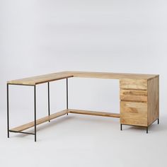 an l - shaped desk with two drawers and a shelf on one side, against a white background