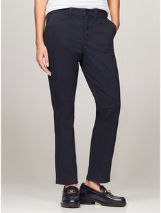 Tommy Hilfiger women's pant. Cut in a slim fit, our chino is made from a stretch cotton blend offering lightweight breathability and comfort.  Material: 77% Better Cotton Initiative, 20% Recycled Cotton, 3% Elastane. Casual Mid-rise Bottoms By Tommy Hilfiger, Cotton Tapered Leg Work Pants, Mid-rise Cotton Work Pants, Cotton Mid-rise Work Pants, Chino Cotton Twill Ankle-length Work Pants, Casual Mid-rise Workwear Chinos, Chino Cotton Twill Ankle Pants For Work, Casual Mid-rise Chinos For Work, Mid-rise Cotton Dress Pants