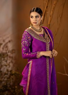 Introducing our stunning Purple Organza Outfit! This elegant dress is adorned with intricate details, featuring beautiful embroidery and embellishments. The rich purple color adds a regal touch, and it comes with a chooridar pajama for a complete look. Perfect for making a statement at special occasions! Elegant Purple Sets With Intricate Embroidery, Elegant Purple Salwar Kameez With Zari Work, Elegant Purple Set With Zari Work, Elegant Purple Sets With Zari Work, Designer Embroidered Purple Salwar Kameez, Designer Purple Unstitched Suit With Resham Embroidery, Elegant Purple Salwar Kameez For Eid, Festive Purple Unstitched Suit With Resham Embroidery, Elegant Purple Sets With Dabka Work