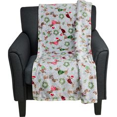 a chair with a christmas themed blanket on it