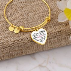 Nana heart bangle bracelet charm with optional engraving. The perfect gift for Mother's day, Christmas, Birthday, or just because. Purchase This Best-seller and We Guarantee It Will Exceed Your Highest Expectations! ➜ Our patent-pending jewelry is made of high quality surgical steel with an 18k gold finish option. This Jewelry Item Is the Perfect Keepsake! Whether for Yourself or a Loved One. ➜ If the custom engraving option is available, engrave onto the back of the pendant your loved one's nam Heart Bangle Bracelet, Heart Pendant Gold, Silver Heart Pendant, Working Mother, Bracelet Charm, Working Moms, Heart Bracelet, Silver Bangles, Gold Bangles