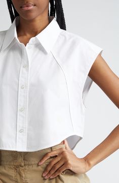 Piping-trimmed raised seams accentuate the unique tailoring of this cropped shirt marked with a flocked Wang-square logo. 19" length (size Medium) Front button closure Point collar Sleeveless, with extended shoulders Curved hem 100% cotton Dry clean Imported Logo Shirts For Women, Cropped Shirt Women, Tailored Shirts For Women, Shirt Collar Blouse Designs, Cropped Button Up, Summer 2025 Fashion Trends, Interesting Collars, Fashion Tops Blouse Style, Unique T Shirt Designs