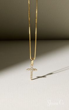 Celebrate Easter with this darling cross necklace. This sparkling cross is made up of 12 round diamonds. These hand-selected gems are set in quality 14k yellow gold, and the dazzling design hangs from a matching 18″ box chain. Article number: 41068462 Elegant Cross Necklace With Box Chain, Yellow Gold Cubic Zirconia Cross Necklace, Gold Cross Pendant Necklace With Box Chain, Gold Cross Necklace With Box Chain, Gold Cross Necklace With Diamond Accents, Gold Crucifix Cross Necklace With Diamond Accents, Yellow Gold Cross Pendant Necklace With Diamond Accents, Yellow Gold Pendant Cross Necklace With Diamond Accents, Yellow Gold Cross Necklace With Diamond Accents