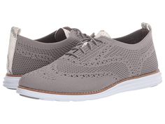 Cole Haan Original Grand Stitchlite Wing Oxford - Women's Shoes : Ironstone Knit/Chalk Python Printed Leather/Optic White Sole/Iro : Keep a smart look wherever you go in the city with the Cole Haan Original Grand Stitchlite Wing Oxford. Oxford sneakers feature a stretch textile upper. Lace-up closure. Rounded toe. Textile lining. Fully padded, fixed sock lining for ultimate comfort. Flexible rubber outsole with Grand.ØS technology for extra cushioning. Imported. Measurements: Weight: 7 oz Produc Luxury Classic Oxfords With Perforations, Sleek Luxury Oxfords For Business Casual, Luxury Oxfords With Cushioned Footbed And Plain Toe, Luxury Plain Toe Oxfords With Cushioned Footbed, Luxury Oxfords With Stitched Sole For Business Casual, Luxury Sleek Oxfords For Business Casual, Luxury White Wingtip Sneakers, Luxury Wingtip Sneakers For Formal Occasions, Luxury Business Casual Oxfords With Stitched Sole