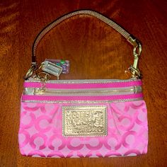 This Is A Beautiful Pink And Gold Coach Vintage Wristlet. Condition Is Brand New And Never Used. Pink Coach Bag As Gift, Pink Wristlet With Removable Pouch, Pink Wristlet With Removable Pouch For Everyday Use, Pink Pouch Wristlet With Strap, Pink Pouch Wristlet With Zipper Closure, Pink Clutch Wristlet With Zipper Closure, Pink Wristlet With Removable Pouch As Gift, Pink Clutch Wristlet, Pink Pouch Wristlet With Wrist Strap