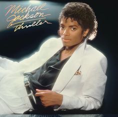 the album cover for michael jackson's career is displayed on a white tablecloth