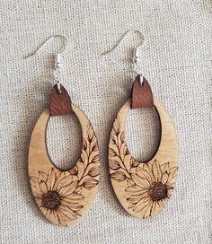 wooden earrings with sunflowers on them