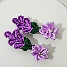 Hand Crafted, Lightweight & Durable. The Flower Hair Clips Are Made Of Grosgrain Ribbon, Attached With A Barrette Clip, 2.5" Metallic Silver Color Each Flower Clip Is Carefully Handmade And Wear-Resistant To Ensure They Are Durable And Shaped Dark Green On Leaves And Stem. 2-Tones Of Purple On The Flowers, Embellished With A Silk 1" Flower Lavander Purple With Rhinestone In The Center. Diameter 3" X 1" The Package Includes 1-Pair Beautiful Girls' Hair Accessories. A Pair Of Floral Shaped Easily Braid Side Ponytail, Hair Bow Sets, Flowers Purple, Floral Ribbon, Purple Tulips, Handcrafted Accessories, Satin Flowers, Bow Set, Kids Hair Accessories