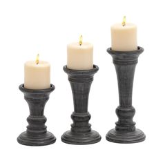 three candles are sitting next to each other