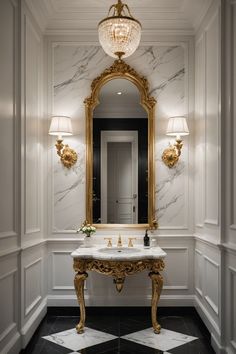 a fancy bathroom with marble flooring and gold accents on the walls, along with a chandelier