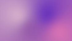 an abstract blurry background with pink and purple hues in shades of lilac