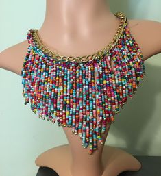 Bold beaded drop rainbow beaded statement necklace with adjustable chain and lobster claw closure. Beautiful colors, medium weight, statement piece. Multicolor Faceted Beads Dangle Necklaces, Multicolor Dangle Necklaces With Faceted Beads, Multicolor Dangling Beads Necklaces, Adjustable Multicolor Beaded Dangle Necklaces, Multicolor Beaded Necklaces With Dangling Beads, Multicolor Large Beads Beaded Necklace, Multicolor Dangling Beaded Necklace, Multicolor Necklaces With Dangling Beads, Multicolor Bohemian Beaded Necklace