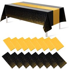 black and yellow tablecloths with gold dots on them