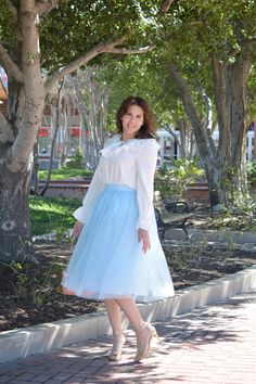 Light blue Fully lined Elastic waist Full skirt Paired with our Suzy top Modeled in medium 5'6" 100% Polyester Small (waist 28-36”/length 29" (lining) 32" (tulle)) Medium (waist 30-38”/length 29" (lining) 32" (tulle)) Large (waist 32-40”/length 29" (lining) 32" (tulle)) Blue Tulle Skirt, White Ruffle Top, Ruffled Neckline, Ruffled Top, Blue Tulle, Ruffle Top, Textured Fabric, Small Waist, Large Bust