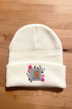 This floral hand-embroidered Carhartt beanie is ready to ship! This is an adult size beanie. If you are interested in custom sizes, colors or designs please message me and I'd be happy to work with you. White Winter Hat With Embroidered Logo, Fitted Embroidered White Hat, White Embroidered Fitted Hat, Embroidered Cotton Beanie One Size Fits Most, Embroidered Cotton Beanie One Size, Embroidered Cotton Beanie (one Size Fits Most), Embroidered Cotton Beanie, One Size Fits Most, Embroidered Cotton Beanie, White Embroidered Beanie Hat