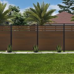 a wooden fence in front of some palm trees