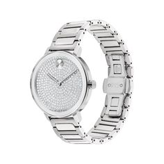 The Movado BOLD Evolution 2.0 is a modern design with a sharp look and elevated feel. 34mm stainless steel case Silver-tone dial with dazzling crystal pave and iconic dot motif Stainless steel bracelet with deployment clasp Modern Diamond Watches With Subdials, Modern Diamond Watches With Round Shape, Modern Diamond Watches With Round Face, Modern Round Diamond Watch, Modern White Gold Diamond Watch, Luxury Silver Diamond Watch With Analog Display, Modern Silver Diamond Watch With Analog Display, Modern White Gold Jewelry With Diamond Hour Markers, Modern Diamond Watch With Metal Dial