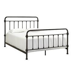 a metal bed frame with white sheets and pillows on it's headboard, against a white background