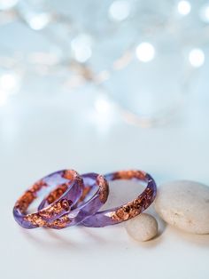 A beautiful clear purple faceted resin ring with rose gold flakes inside. This resin ring is perfect for stacking! It's faceted all the way around and it is so comfortable to wear. All my resin rings are handmade with self-made molds. they are also hand-sanded and polished, to be smooth and comfortable to wear. Given the nature of the resin, my rings may contain tiny bubbles and imperfections, but I always try to make them as perfect as possible. The listing is for ONE stacking ring with metal f Unique Rings For Women, Purple Resin, Gold Star Earrings, Resin Rings, Promise Rings For Her, Gold Moon, Celestial Jewelry, Resin Ring, Self Made