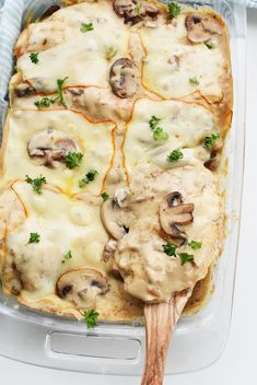 a casserole dish with mushrooms and cheese