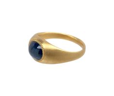 Absolutely stunning in its classic design and timeless elegance, this Prounis ring adds just the right amount of cool toned color and substantial presence to any established collection. The oval blue sapphire cabochon is horizontally encased in the setting of recycled 22K yellow gold. A frame of meticulously hand-wrought granulation surrounds the stone. blue sapphire : 7mm x 8mm22K yellow gold band : 2.5mm to 9.5mmavailable size : 7please contact us for sizing options Daniela Villegas, Digby And Iona, Rebecca Overmann, Sapphire Cabochon, Pippa Small, Zoe Chicco, Cathy Waterman, Semi Precious Gems, Single Stone