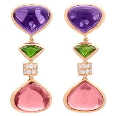 Marina Bulgari has always been known for bold & beautiful design, and this incredible pair of earrings are no exception. Featuring 12.07 carats of pink tourmaline, 9.91 carats of amethyst, and 0.43 carats of fine white diamonds, these Marina B. stunners are sure to stand out in a crowd. Measuring 2 inches in length and weighing 21.4 grams, these earrings are a true example of how Marina B. has gone on to deliver style and fashion worthy of the Bulgari last name. Bubble Earrings, Gold Diamond Hoop Earrings, Sabyasachi Jewellery, Gold Chandelier Earrings, 18k Gold Earrings, Yellow Earrings, Gold Diamond Earrings, Fabulous Jewelry, Women Diamond