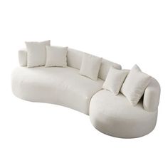 a large white couch with pillows on it's back and arms, sitting in front of a white background