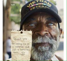 an old man with a note attached to his face that says thank you for serving me as a veteran and not a homeless man