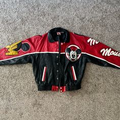 This Vintage Mickey Mouse Bomber Jacket Is A Rare Find From The 1990's. The Jacket Is Made Of High-Quality Leather And Features A Colorful Design With Mickey Mouse On The Front And Back. The Jacket Is Suitable For Adults And Is A Size L. It Is Perfect For Collectors Of Disney Memorabilia Or Anyone Who Loves Vintage Fashion. It Is In Fantastic Condition For Its Age. It Was Recently Professionally Cleaned And Treated. The Leather Was Also Conditioned With A Protectant. The Jacket Was Made By Micke Disney Jacket, Vintage Mickey Mouse, Vintage Mickey, Colorful Design, Jacket Coat, High Quality Leather, Color Design, Casual Wear, Bomber Jacket