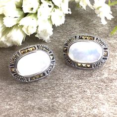 ✦Gemstone: Mother of Pearl/Marcasite ✦Material: Sterling Silver ✦Color: white ✦Shape: oval ✦Size: 23x14mm ✦Weight: 6.2g ✦QTY: 1 pair earrings / package ♕Beautiful & High Quality Findings♕ Mother Of Pearl is considered an auspicious stone for women. The luster and shine of the pearl resemble the beauty, grace, and elegance of a woman. Pearls signify wisdom, learning, creativity, perseverance, and purity to name a few. The color white symbolizes purity in many cultures and so too does Mother Of Pearl signify purity with its shiny lustrous white appearance. You will receive the same quality has you see in picture. CLICK BELOW TO CHECK ALL OUR BEAUTIFUL GEMSTONE BRIOLETTES. https://www.etsy.com/shop/TurquoiseFactory?ref=seller-platform-mcnav Color may vary slightly due to your monitors' color Classic White Oval Earrings, White Sterling Silver Oval Earrings, White Oval Sterling Silver Earrings, White Oval Earrings For Wedding, Classic White Gemstone Earrings, White Sterling Silver Clip-on Jewelry, Oval Gemstone Clip-on Earrings For Gifts, Oval Clip-on Earrings For Gift, White Clip-on Jewelry For Anniversary