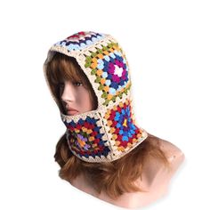 Crafted with care and creativity, this handmade Granny Square Balaclava is a true work of art.  Crocheted with precision and attention to detail, this charming balaclava features a delightful granny square pattern, adding a touch of vintage flair to its design.  Perfect as a thoughtful gift for loved ones, this balaclava is a unique and practical accessory for chilly days. Its unisex style makes it versatile for anyone to wear, adding a cozy and stylish layer to any outfit. Whether you're heading outdoors for a winter adventure or simply want to showcase a one-of-a-kind piece, this Granny Square Balaclava is sure to make a statement. Treat yourself or someone special to this cozy crochet creation that blends craftsmanship and nostalgia effortlessly. Washable for easy care.  It is best to h Winter Crochet Crafts With Yarn, Handmade Multicolor Crochet Hat For Cold Weather, Hand Knitted Multicolor Crochet Hat For Outdoor, Handmade Multicolor Crochet Hat For Outdoor, Bohemian Crochet Hat With Granny Square For Winter, Multicolor One Size Balaclava For Winter, Multicolor Winter Balaclava For Outdoor Use, Winter Crochet Patterns In Acrylic, Handmade Multicolor Winter Crafts