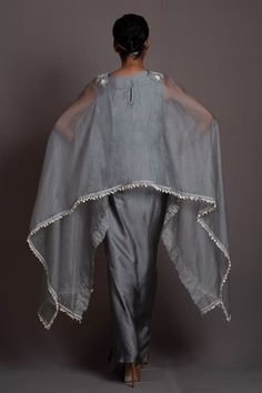 Grey cape with floral embroidery and asymmetric long sleeves. Paired with an inner crop top and draped skirt. - Aza Fashions Floral Cape, Embroidered Cape, Draped Skirt, Fashion App, Set For Women, Aza Fashion, Fashion Set, Floral Embroidery, Skirt Set