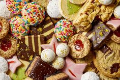 an assortment of desserts and pastries on a white plate with sprinkles