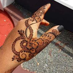 a person with henna on their hand